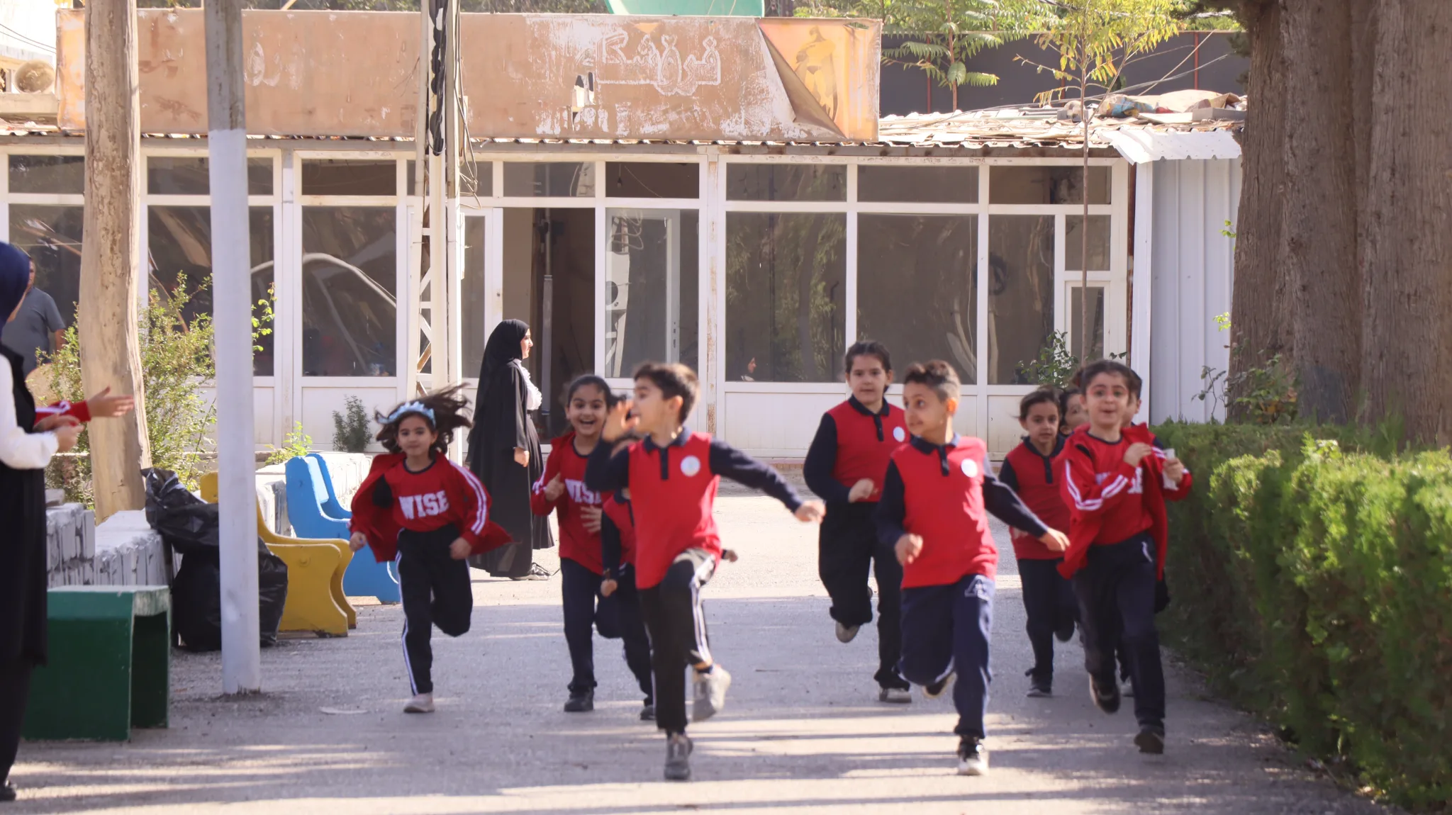 Primary students running in the schoolyard